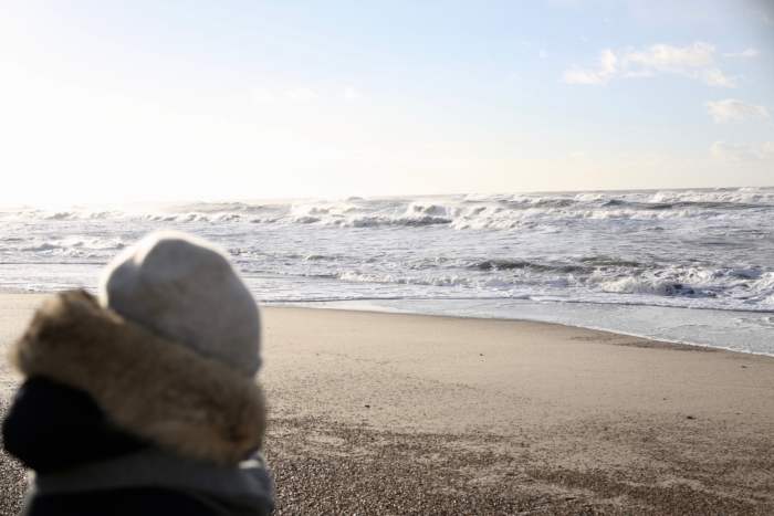 beach in winter, warm jacket, hat