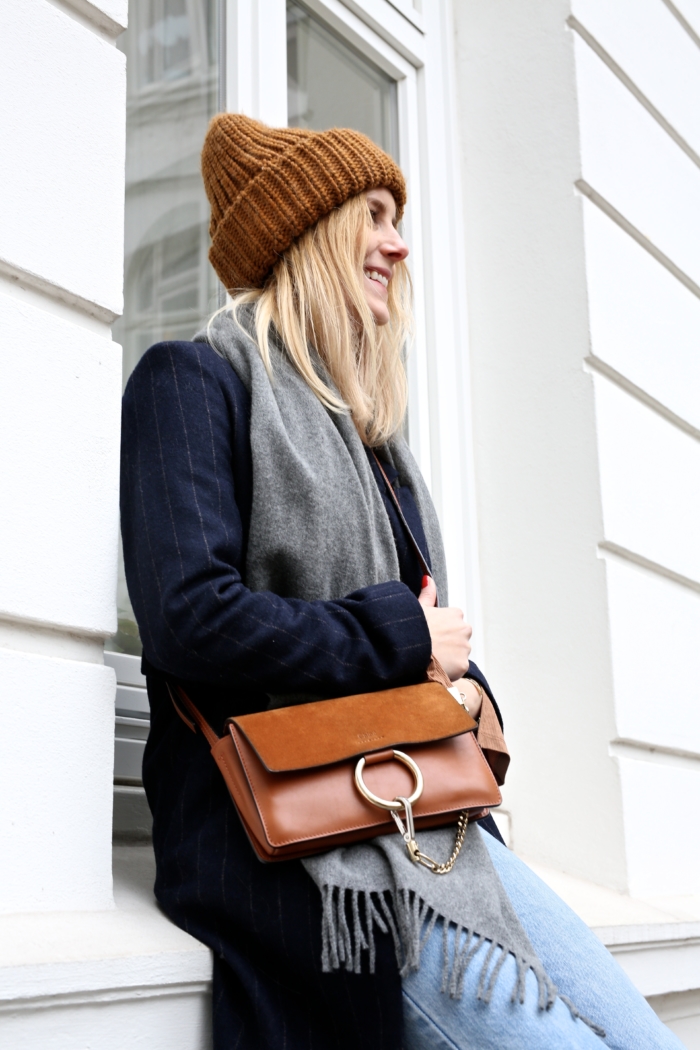 Cloé purse, blue coat, grey scarf, beanie