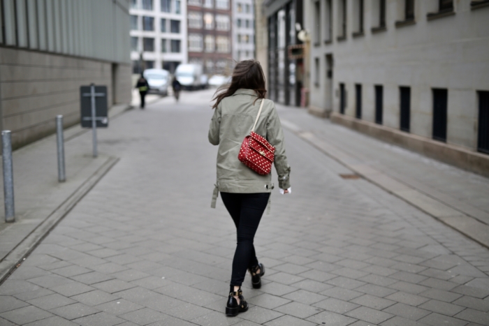 green jacket, dark red Valentino Rock Stud, ankle boots