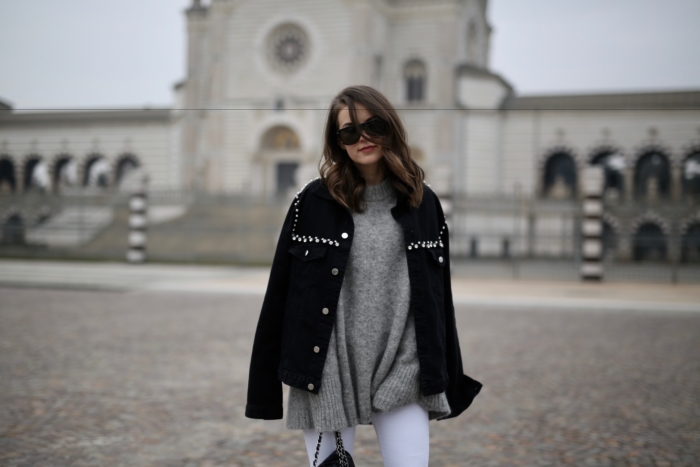 black Pinko jacket with studs, grey sweater, Tom Ford shades