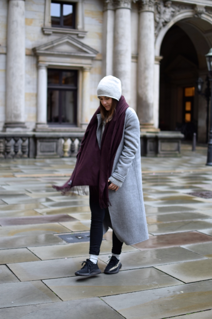 long grey coat, scarf, yeezy sneakers