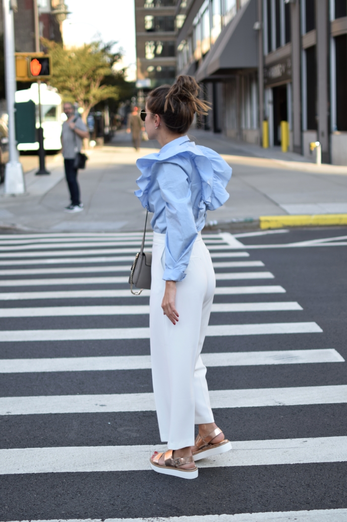 white pants, blouse, brown hair