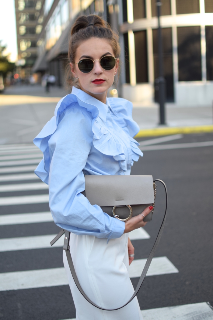 blouse with ruffles, grey bag, sunglasses