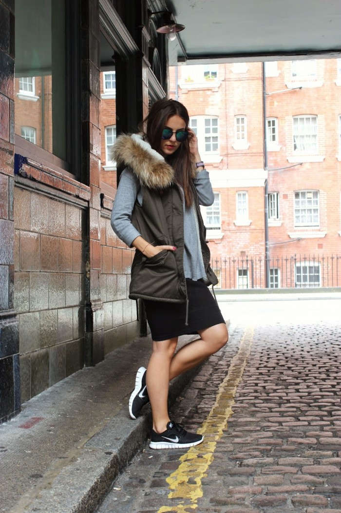 Green vest with fur hoody by IQ+Berlin